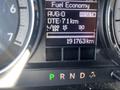 Dashboard display of a 2011 RAM 1500 showing fuel economy, average distance, fuel consumption, and total kilometers driven