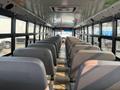 Interior of a 2007 Freightliner B2 school bus featuring rows of gray seats and large windows along the sides