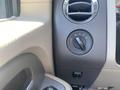 Close-up of the control panel in a 2013 Ford Expedition with knobs for lighting and air circulation settings