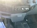 Interior view of a 2015 Ford F-450 SD dashboard showing control buttons and switches