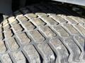 Close-up of a worn tire tread from a 2010 Kubota F3990 showing detailed grooves and surface wear