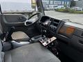 Interior view of a 2009 Ford LCF 550 showing the driver's seat dashboard gear shift and controls
