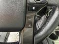 Close-up of the steering wheel controls in a 2021 Toyota 4Runner featuring buttons for seat adjustments and cruise control