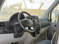 Interior view of a 2016 Mercedes-Benz Sprinter showing the steering wheel dashboard and controls