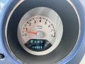 The dashboard of a 2007 Chrysler PT Cruiser showing the RPM gauge and odometer reading 143869