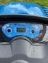 A blue dashboard display of a 2021 LS XJ2025H tractor showing various gauges and digital readings for speed and engine performance