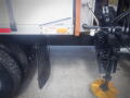 A 2016 International WorkStar 7500 truck with visible tires and hydraulic components in the foreground