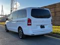 A white 2022 Mercedes-Benz Metris van with a sleek design and tinted windows viewed from the rear side