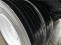 Close-up of the tires on a 2018 Hino 195 showing their tread pattern and details of the wheel rim