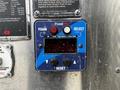 Control panel of a FoamPro system with buttons for foam selection and reset along with a digital display showing flow and total foam readings