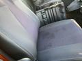 The interior seat of a 2013 International 4300 truck showing fabric upholstery with a gray and black pattern