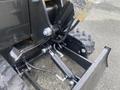 Close-up view of the hydraulic system of a 2024 AGT Industrial H13R Mini Excavator featuring a piston and connecting pipes