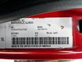 A label on a 2011 International 4400 displaying the VIN model number weight and manufacturing date along with manufacturer information