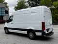 A 2020 Mercedes-Benz Sprinter van in white with a smooth body design and black accents on the lower half and wheels
