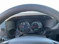 The dashboard of a 2013 Chevrolet Silverado 1500 showing the speedometer tachometer and various gauges in a circular display