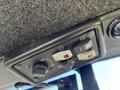 Control panel featuring various switches and knobs on a Kubota F3990 tractor