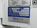 2012 Ford F-450 SD with a metal inspection label attached featuring information about make model serial and inspection dates