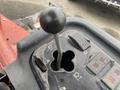 Close-up of the control panel of a 2011 Toro Reelmaster 3100-D with a gear shift lever and various function indicators
