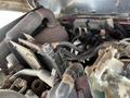 Engine compartment of a 2014 Toro Groundmaster 5910 showing various mechanical components and wiring with some dirt and wear visible