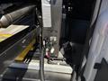 A 2016 RAM Promaster featuring a close-up of its interior equipment including wiring and connectors mounted on a panel