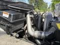 Close-up of a 2011 International 4300 engine showing the air intake system and various hoses and connections