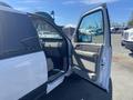 A 2013 Ford Expedition with its driver's side door open revealing the interior features and seating