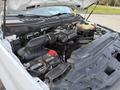 The engine compartment of a 2018 Ford F-350 showing the engine components battery and air intake system