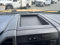 Dashboard view of a 2017 Ford F-250 SD with a storage compartment and control panel visible