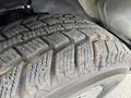 Close-up view of a tire from a 2013 Chevrolet Express showing tread patterns and texture