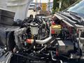 2020 Chevrolet Silverado engine bay showing various components including the engine block battery and coolant reservoir