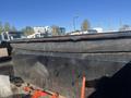 2024 Southland 18 Foot Dump Trailer with a black bed and a tarp cover on top of the sides