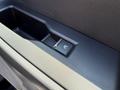 Close-up of the window control switch in the door panel of a 2023 Ford F-550