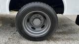 Close-up of a tire and alloy wheel of a 2007 Ford F-550 showing tread pattern and wheel design