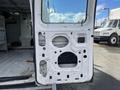A 2008 Ford Econoline van door with its inner panel removed showcasing the mechanics and structure inside the door
