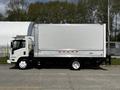 A white 2016 Isuzu NQR box truck with a large aluminum cargo area and red stripe details on the side