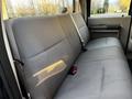 The image shows the backseat of a 2008 Ford F-250 SD featuring gray cloth upholstery with seat belts and a wide bench design