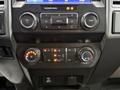 Dashboard controls of a 2021 Ford F600 including knobs for volume media and climate settings