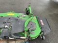 2014 John Deere 1585 Terrain Cut mower with a green and black color scheme featuring a cutting deck and various control levers