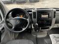 Interior view of a 2016 Mercedes-Benz Sprinter showing the steering wheel dashboard and control panel