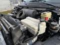 A close-up view of the engine compartment of a 2006 GMC C5000 showing various components including a large air intake and several fluid reservoirs
