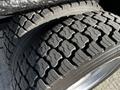Close-up of a 2018 Ford F-550 tire with a detailed tread pattern showcasing deep grooves and robust rubber structure