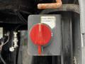Red rotary switch labeled Crane Master Disconnect on a black control panel in a 2016 Ford F-550 vehicle