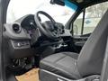 Interior view of a 2021 Mercedes-Benz Sprinter showing the driver's seat steering wheel and dashboard with digital displays and controls