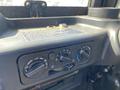 The interior control panel of a 2018 Kubota RTV-X 1100 C featuring various dials for temperature and air conditioning settings