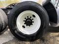 Close-up of a 2012 Volvo VNL tire showing the white rim and black tire with the brand name Continental and model details visible on the side