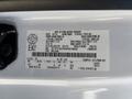 White 2016 Ford F-150 featuring a label with vehicle specifications including weight dimensions and manufacturing details
