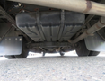 2020 Chevrolet Express van viewed from below showing the fuel tank and exhaust system components