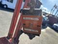 A hydraulic proportional control unit from a 2010 SkyJack SJ with a weathered orange and black casing showing wear and tear