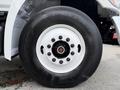 Close-up of a tire on a 2017 Hino 338 featuring a white rim with multiple bolts and a Hankook branding on the black tread