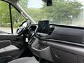 Interior view of a 2022 Ford Transit showing the steering wheel central console and touchscreen display